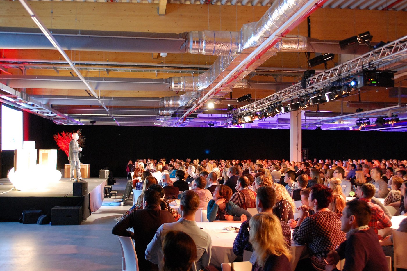 Ramon Vullings delivering a keynote to a seated audience